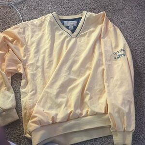 Yellow windbreaker from cutter and buck